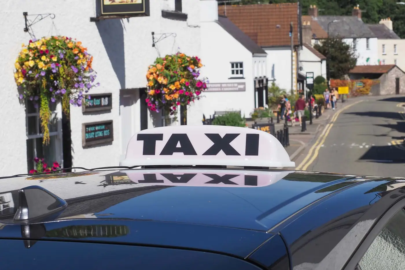 CHEPSTOW, UK - CIRCA SEPTEMBER 2019: taxi sign on a car
